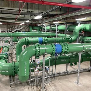 Huge green pipes inside the Thornton Water Treatment Plant