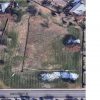 Aerial view of a small detention pond area