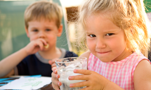 Two kids drinking water