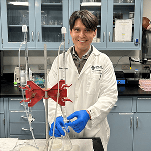 Man testing water with a test tube and beaker