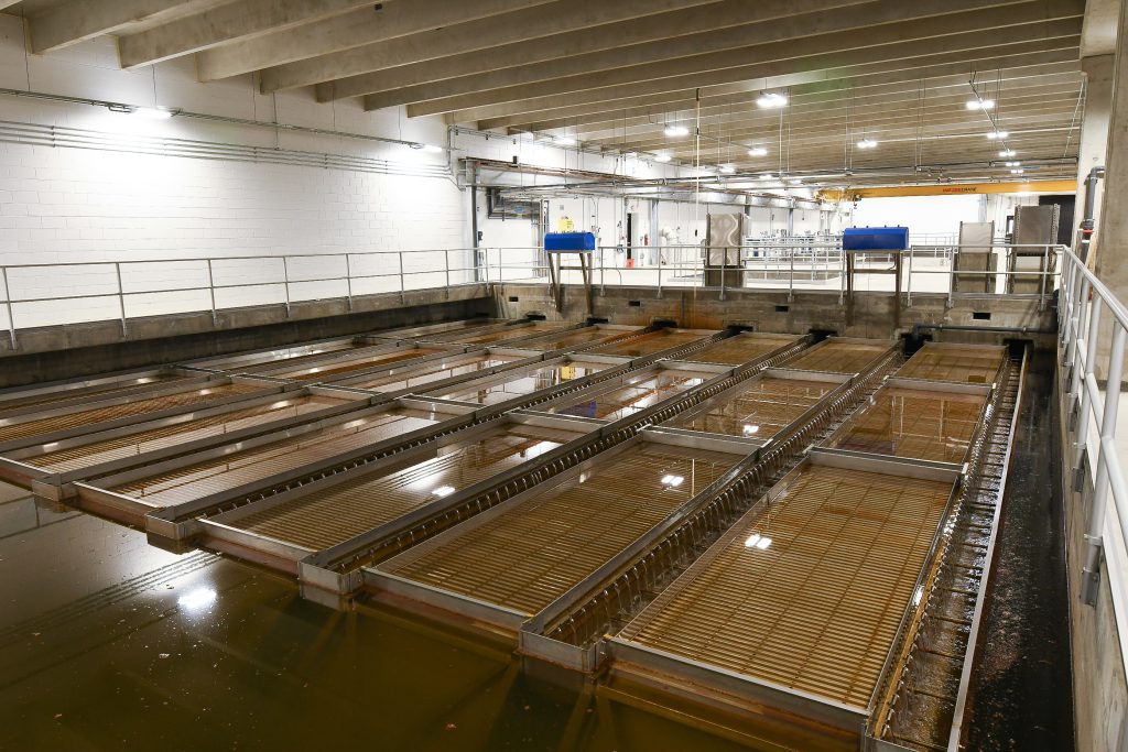 Water treatment trays show how water is purified in a Thornton Water treatment facility.